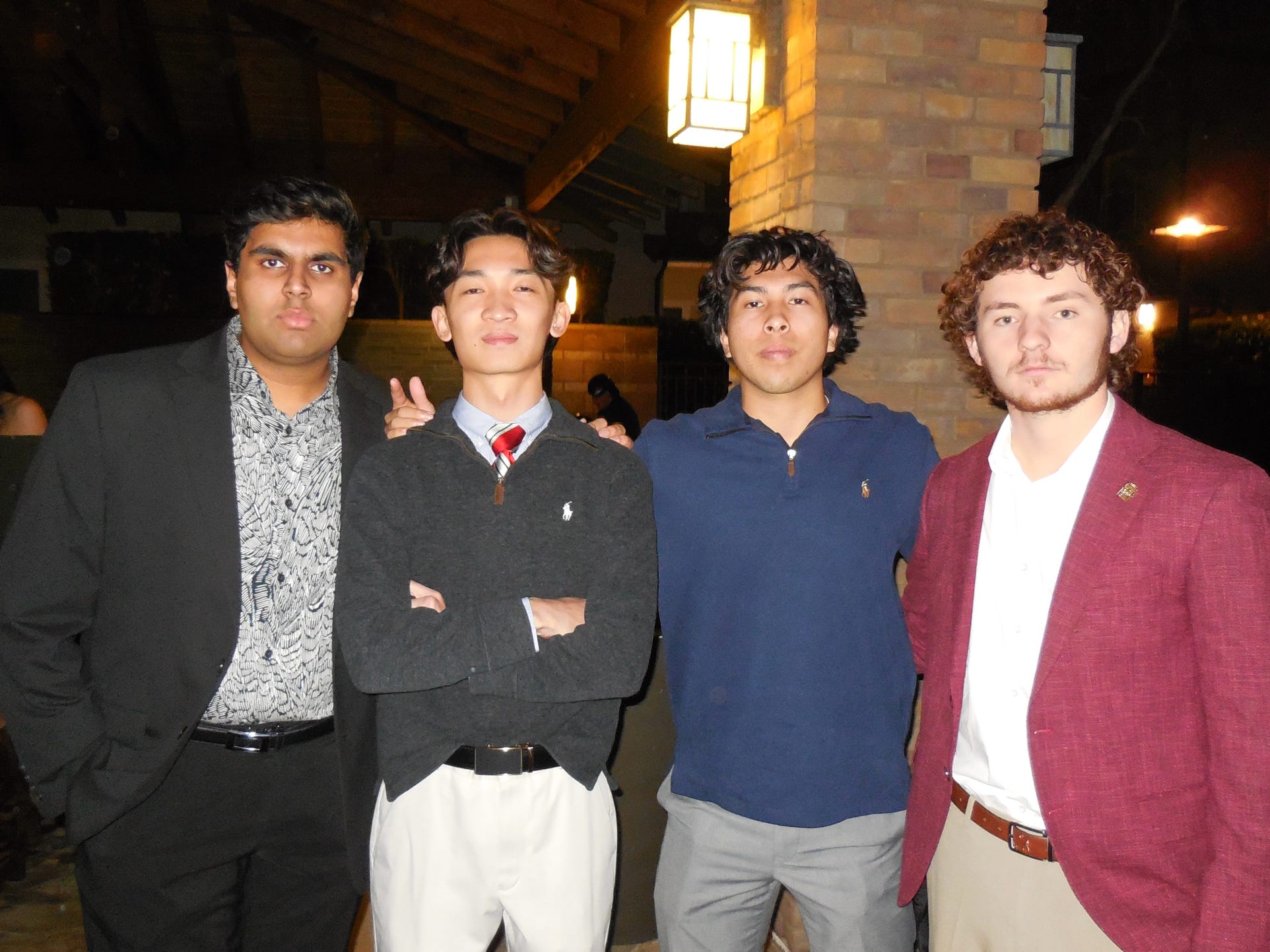 Four chapter members dressed up at a formal