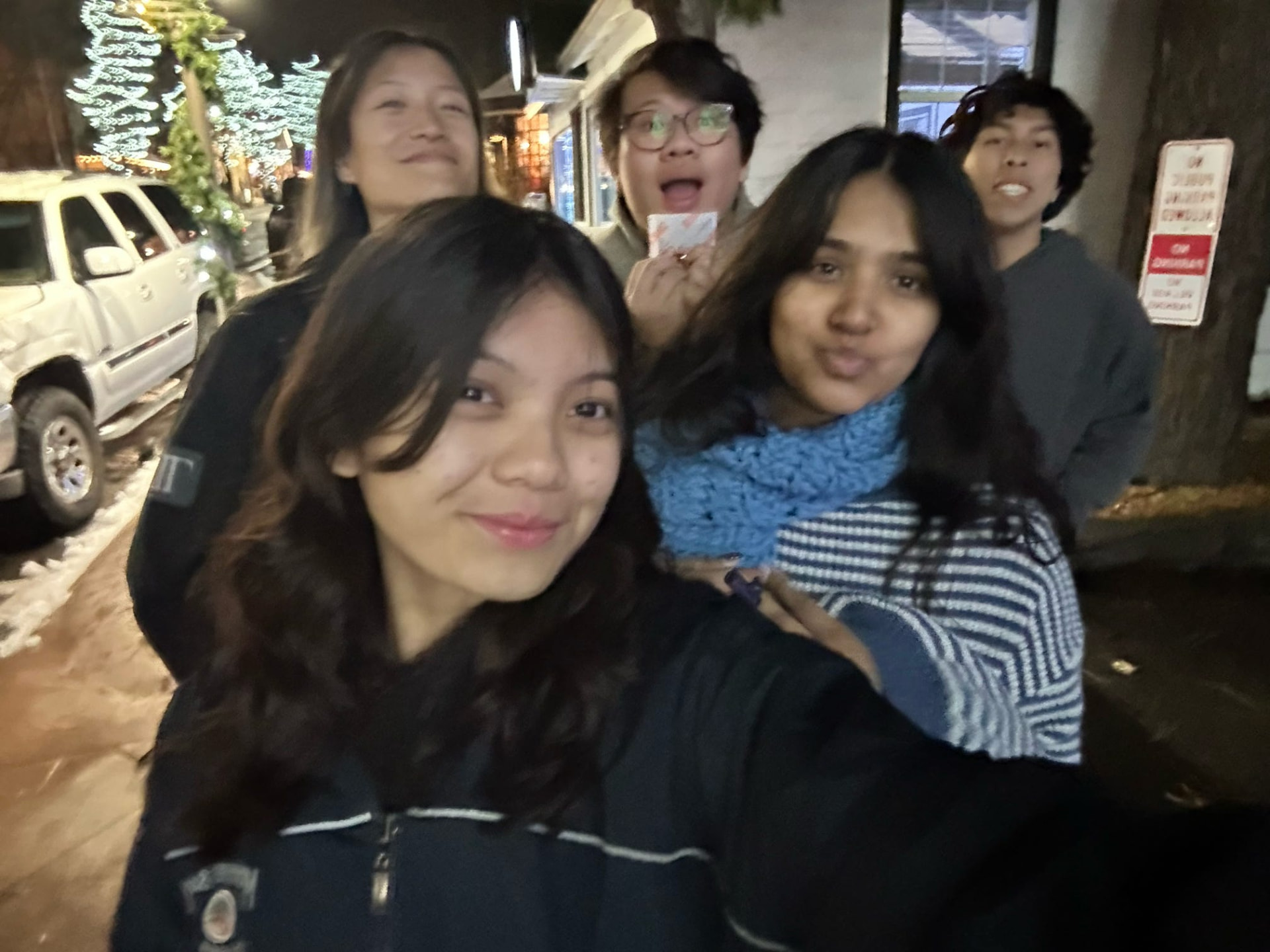 Five chapter members on a nighttime winter walk