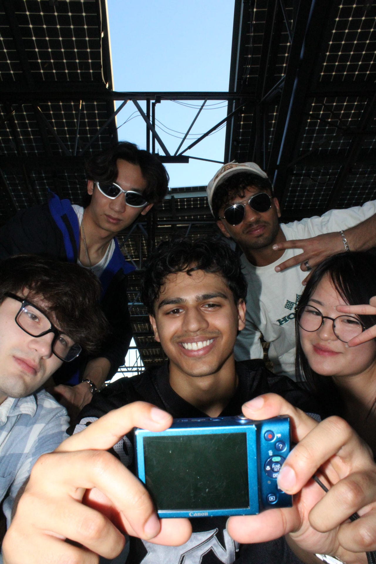 Chapter members crowding in for a selfie with a digital camera