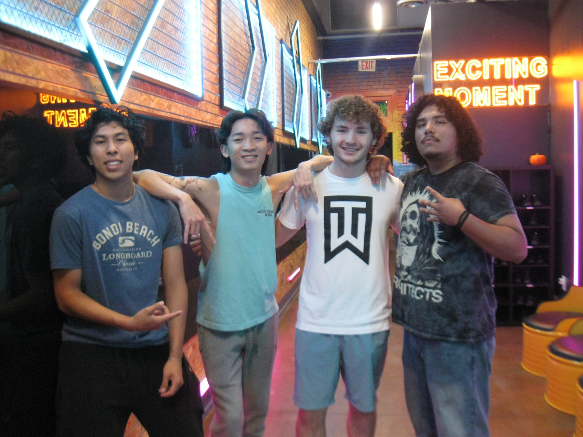 Four chapter members together at an arcade game night