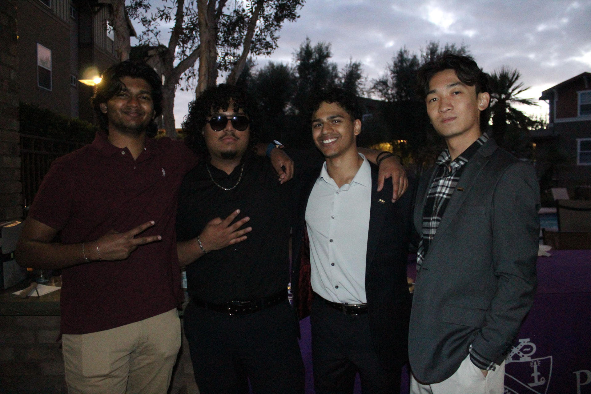 Four chapter members together at a formal event