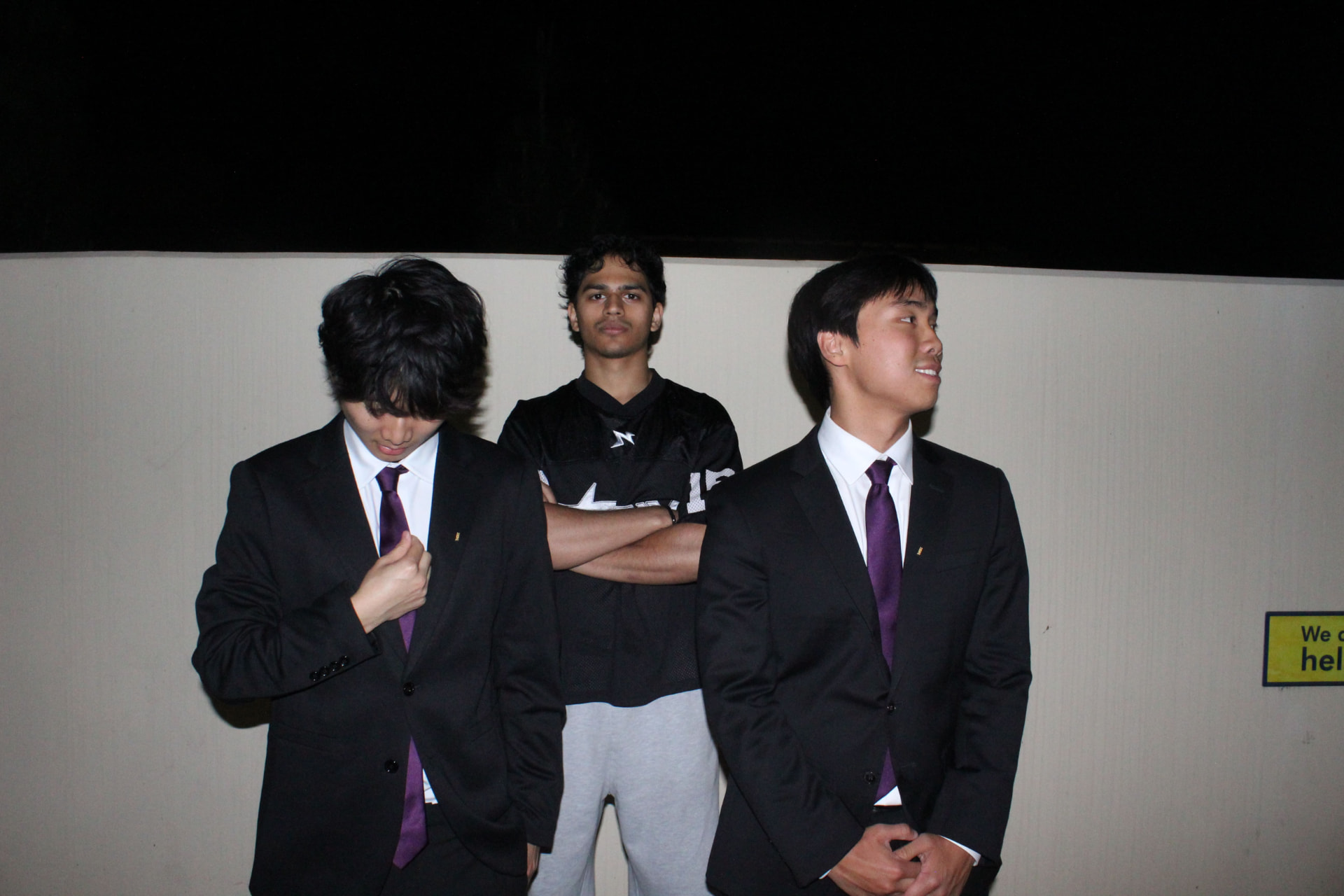 Three chapter members together after a formal event
