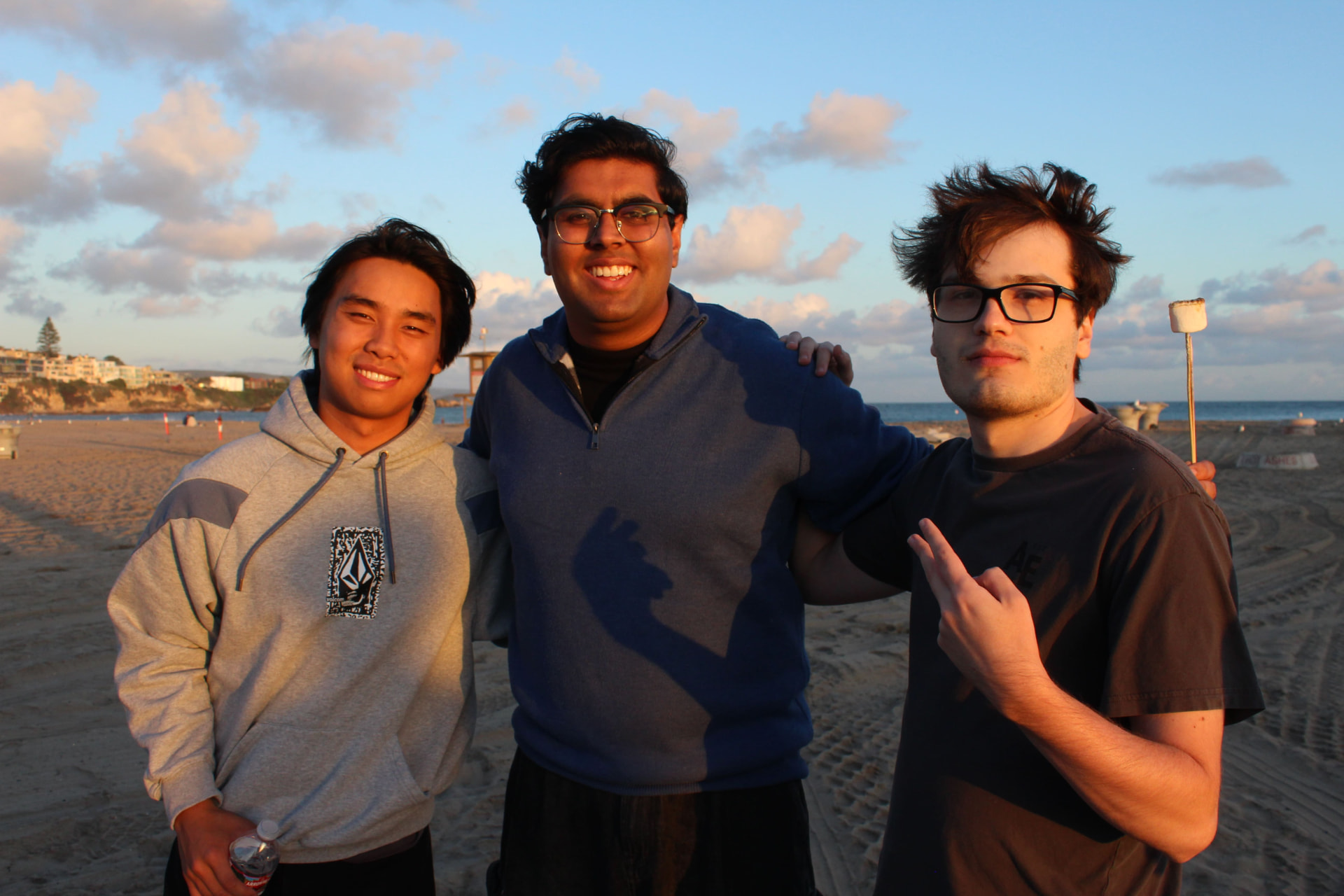 Three chapter members together at the beach